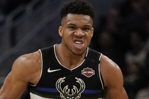 Milwaukee Bucks' Giannis Antetokounmpo reacts after a dunk during the second half of an NBA basketball game against the Philadelphia 76ers Thursday, Feb. 6, 2020, in Milwaukee. The Bucks won 112-101. (AP Photo/Morry Gash)