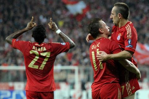 (From R) Bayern Munich's French midfielder Franck Ribery, Bayern Munich's Croatian striker Ivica Olic and Bayern Munich's defender Diego Contento celebrate during the UEFA Champions League second leg quarter-final football match FC Bayern Munich vs Olympique de Marseille in Munich, southern Germany, on April 3, 2012. AFP PHOTO / CHRISTOF STACHE (Photo credit should read CHRISTOF STACHE/AFP/Getty Images)