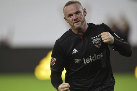 D.C. United forward Wayne Rooney celebrates his first MLS goal during the first half of a soccer match against the Colorado Rapids in Washington, Saturday, July 28, 2018. (AP Photo/Susan Walsh)