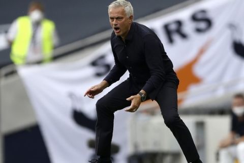 Tottenham's manager Jose Mourinho reacts during the English Premier League soccer match between Tottenham Hotspur and Arsenal at the Tottenham Hotspur Stadium in London, England, Sunday, July 12, 2020. (Tim Goode/Pool via AP)
