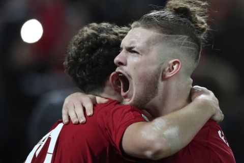 Liverpool's Harvey Elliott, right, and Liverpool's Curtis Jones celebrate during the English League Cup soccer match between Liverpool and Arsenal at Anfield stadium in Liverpool, England, Wednesday, Oct. 30, 2019. (AP Photo/Jon Super)