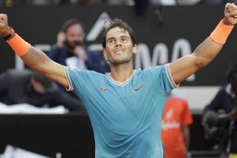 Rafael Nadal of Spain celebrates winning against Novak Djokovic of Serbia at the end of their final match at the Italian Open tennis tournament, in Rome, Sunday, May 19, 2019. (AP Photo/Gregorio Borgia)