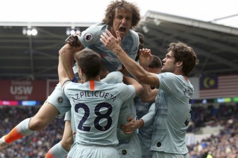 Chelsea's David Luiz celebrates after Ruben Loftus-Cheek scores his side's second goal of the game against Cardiff City during their English Premier League soccer match at the Cardiff City Stadium, in Cardiff, Wales, Sunday March 31, 2019. (Nick Potts/PA via AP)