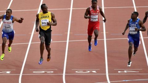 Jamaica's Usain Bolt, second left, looks towards United States' Christian Coleman as they cross the finish line in their Men's 100 meters semifinal during the World Athletics Championships in London Saturday, Aug. 5, 2017. (AP Photo/Martin Meissner)