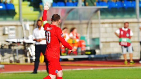 England's forward Wayne Rooney celebrates after scores against San Marino during the EURO 2016 qualifying football match San Marino vs England at the San Marino stadium in Serravalle on September 5, 2015.  AFP PHOTO / VINCENZO PINTO        (Photo credit should read VINCENZO PINTO/AFP/Getty Images)