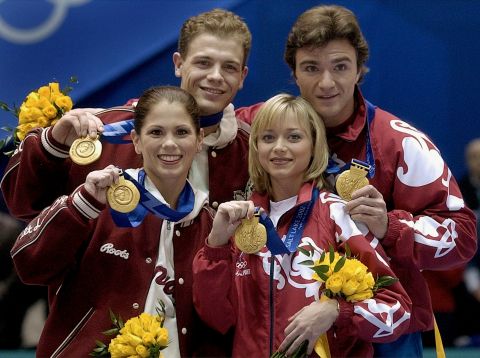 Jamie Sale and David Pelletier of Canada and Elena Berezhnaya and Anton Sikharulidze of Russia pose with their gold medals at a special awards ceremony for the figure skating pairs competition at the Winter Olympics in Salt Lake City, Sunday, Feb. 17, 2002. (AP Photo/Amy Sancetta)