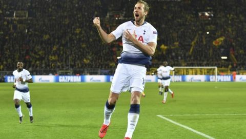 Tottenham forward Harry Kane celebrates after scoring the opening goal during the Champions League round of 16, 2nd leg, soccer match between Borussia Dortmund and Tottenham Hotspur at the BVB stadium in Dortmund, Germany, Tuesday, March 5, 2019. (Bernd Thissen/dpa via AP)