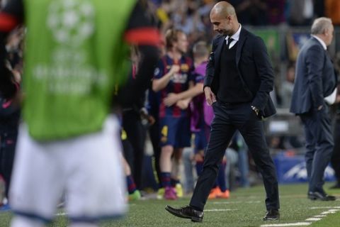 Bayern Munich's Spanish head coach Pep Guardiola looks down during the UEFA Champions League football match FC Barcelona vs FC Bayern Muenchen at the Camp Nou stadium in Barcelona on May 6, 2015.     AFP PHOTO / JOSEP LAGO        (Photo credit should read JOSEP LAGO/AFP/Getty Images)
