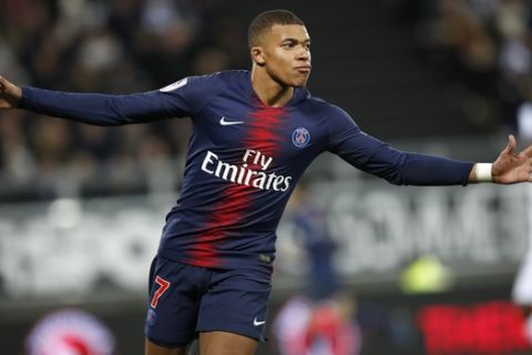 PSG's Kylian Mbappe celebrates after scoring his side's second goal during the French League One soccer match between Amiens and Paris-Saint-Germain at the Stade de la Licorne stadium in Amiens, France, Saturday, Jan. 12, 2019. (AP Photo/Christophe Ena)