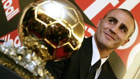 Real Madrid's Fabio Cannavaro, the captain of Italy's soccer World Cup champion team, poses with his Golden Ball award during a press conference at the headquarters of French sports daily "L'Equipe", Monday, Nov. 27, 2006 in Issy-les-Moulineaux, outside Paris. Cannavaro won the 2006 Golden Ball trophy, the French football magazine's prestigious award as Europe's top player. (AP Photo/Francois Mori)
