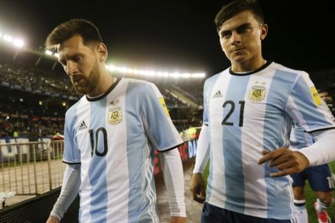 Argentina's Lionel Messi , left, and his teammate Paulo Dybala leave the field at the half time during a 2018 World Cup qualifying soccer match against Venezuela in Buenos Aires, Argentina, Tuesday, Sept. 5, 2017. (AP Photo/Victor R. Caivano)