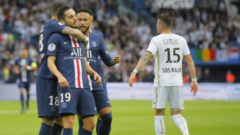 PSG's Pablo Sarabia, center celebrates his opening goal with his teammates PSG's Mauro Icardi, left, and PSG's Neymar during French League One soccer match between PSG and Angers at the Parc des Princes stadium in Paris, Saturday, Oct. 5, 2019. (AP Photo/Michel Euler)
