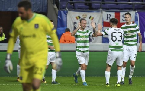 Celtic's Leigh Griffiths, center, jubilates with teammates after scoring the first goal during a Champions League Group B soccer match between Anderlecht and Celtic at the Constant Vanden Stock stadium in Brussels, Wednesday, Sept. 27, 2017. (AP Photo/Geert Vanden Wijngaert)