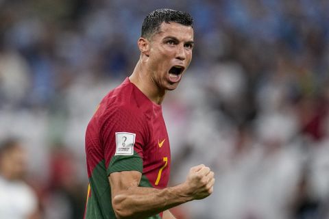Portugal's Cristiano Ronaldo celebrates after scoring his side's opening goal during the World Cup group H soccer match between Portugal and Uruguay, at the Lusail Stadium in Lusail, Qatar, Monday, Nov. 28, 2022. (AP Photo/Abbie Parr)