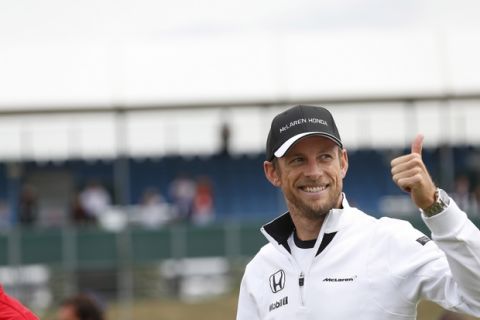Jenson Button give a thumbs up.