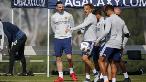 LA Galaxy's newest player Zlatan Ibrahimovic, left, of Sweden, in actions during an MLS soccer training session at the StubHub Center, Friday, March 30, 2018, in Carson, Calif. (AP Photo/Ringo H.W. Chiu)