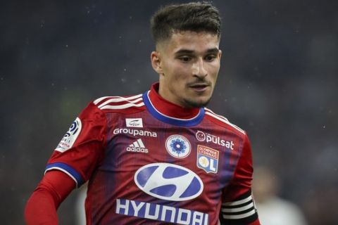 Lyon's Houssem Aouar sprints to intercept the ball during the French League One soccer match between Marseille and Lyon at the Velodrome stadium in Marseille, southern France, Sunday, Nov. 10, 2019. (AP Photo/Daniel Cole)