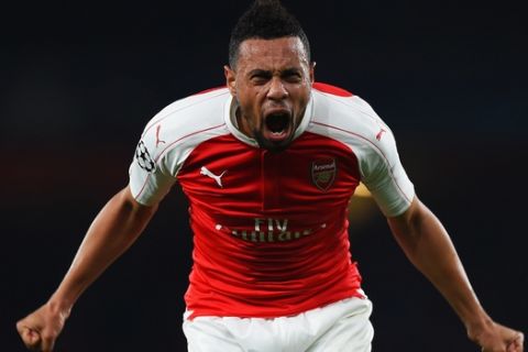 LONDON, ENGLAND - OCTOBER 20:  Francis Coquelin of Arsenal celebrates as Olivier Giroud scores their first goal during the UEFA Champions League Group F match between Arsenal FC and FC Bayern Munchen at Emirates Stadium on October 20, 2015 in London, United Kingdom.  (Photo by Shaun Botterill/Bongarts/Getty Images)