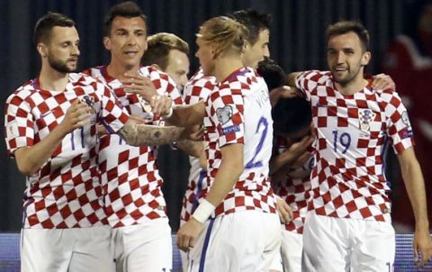 Croatia players celebrate their opening goal during the World Cup Group I qualifying soccer match between Croatia and Ukraine, at Maksimir stadium in Zagreb, Croatia, Friday, March 24, 2017. (AP Photo/Darko Bandic)