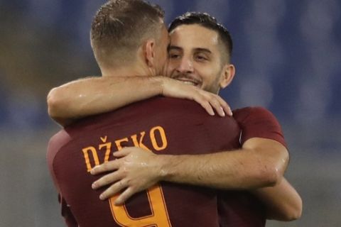 Romas Kostas Manolas, right, celebrates with teammate Edin Dzeko after scoring, during a Serie A soccer match between Roma and Inter Milan, at Rome's Olympic Stadium, Sunday, Oct. 2, 2016. (AP Photo/Andrew Medichini)