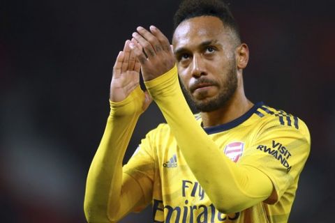 Arsenal's Pierre-Emerick Aubameyang reacts at the end of the English Premier League soccer match between Manchester United and Arsenal at Old Trafford in Manchester, England, Monday, Sept. 30, 2019. (AP Photo/Dave Thompson)