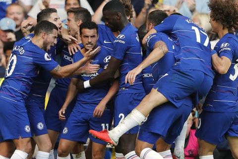 Chelsea's Pedro, center, celebrates with teammates after scoring his side's first goal during the English Premier League soccer match between Chelsea and Bournemouth at Stamford Bridge stadium in London, Saturday, Sept. 1, 2018.(AP Photo/Frank Augstein)