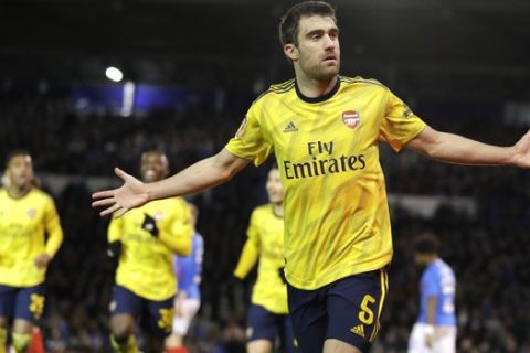 Arsenal's Sokratis Papastathopoulos celebrates after scoring his side's first goal during the English FA Cup fifth round soccer match between Portsmouth and Arsenal at Fratton Park stadium in Portsmouth, England, Monday, March 2, 2020. (AP Photo/Kirsty Wigglesworth)