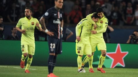 (From L) Barcelona's defender Jordi Alba, Barcelona's Argentinian forward Lionel Messi and Barcelona's Uruguayan forward Luis Suarez celebrate their second goal during the UEFA Champions league quarter-final first leg football match PSG vs FC Barcelona at the Parc des Princes stadium in Paris on April 15, 2015.  AFP PHOTO / MIGUEL MEDINA        (Photo credit should read MIGUEL MEDINA/AFP/Getty Images)