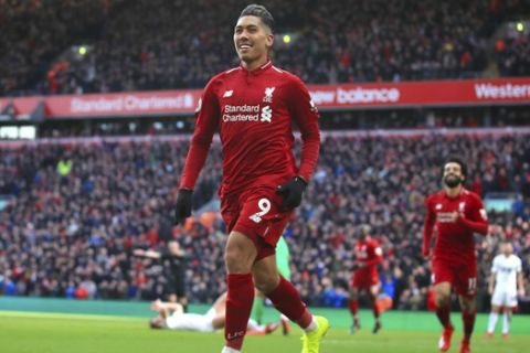 Liverpool's Roberto Firmino celebrates scoring his side's third goal of the game during the English Premier League soccer match between Liverpool and Burnley at Anfield, Liverpool, England, Sunday, March 10, 2019. (Peter Byrne/PA via AP)