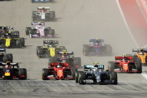 Mercedes driver Valtteri Bottas, of Finland, leads the field at the start of the Formula One U.S. Grand Prix auto race at the Circuit of the Americas, Sunday, Nov. 3, 2019, in Austin, Texas. (AP Photo/Eric Gay)