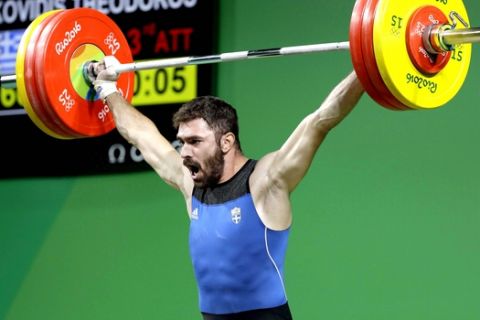 Theodoros Iakovidis, of Greece, competes during the men's 85kg weightlifting competition at the 2016 Summer Olympics in Rio de Janeiro, Brazil, Friday, Aug. 12, 2016. (AP Photo/Mike Groll)