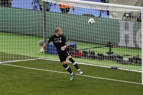 Liverpool goalkeeper Loris Karius looks at the ball after Real Madrid's Gareth Bale scored his side's 3rd goal during the Champions League Final soccer match between Real Madrid and Liverpool at the Olimpiyskiy Stadium in Kiev, Ukraine, Saturday, May 26, 2018. (AP Photo/Darko Vojinovic)