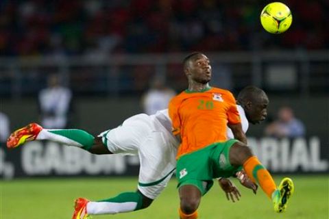 Zambia's Emmanuel Mayuka, front, fights for the ball with Senegal's Cheikh Mbengue during the African Cup of Nations Group A soccer match in Bata, Equatorial Guinea, Saturday, Jan. 21, 2012. (AP Photo/Ariel Schalit)