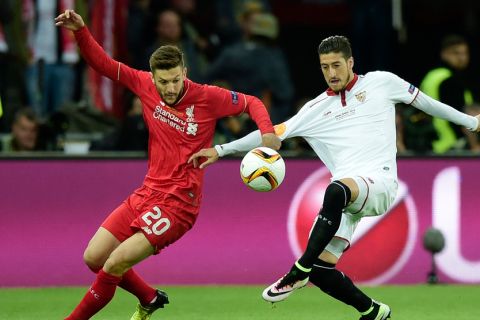 "Liverpool's English midfielder Adam Lallana (L) vies for the ball with  Sevilla's Spanish defender Sergio Escudero  during the UEFA Europa League final football match between Liverpool FC and Sevilla FC at the St Jakob-Park stadium in Basel, on May 18, 2016.   AFP PHOTO / JAVIER SORIANO / AFP / JAVIER SORIANO        (Photo credit should read JAVIER SORIANO/AFP/Getty Images)"