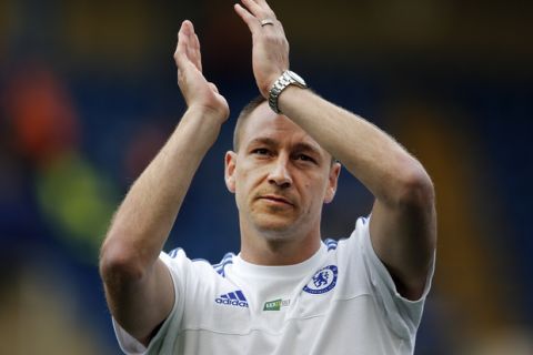 Chelsea's John Terry applauds to supporters after the English Premier League soccer match between Chelsea and Leicester City at Stamford Bridge stadium in London, Sunday, May 15, 2016. (AP Photo/Frank Augstein)