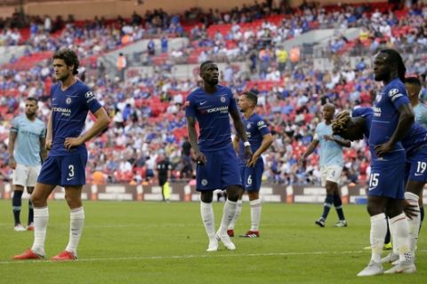 Chelsea players look dejected after they lost the Community Shield soccer match between Chelsea and Manchester City at Wembley, London, Sunday, Aug. 5, 2018. (AP Photo/Tim Ireland)