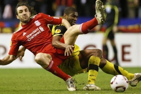 Liverpool's Sotirios Kyrgiakos, left, vies for the ball against Sparta Prague's Leony Kweuke during the second leg of their round of 32 Europa League soccer match at Anfield, Liverpool, England, Thursday, Feb. 24, 2011. (AP Photo/Tim Hales)