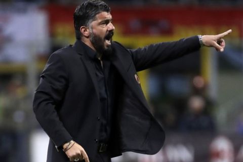 FILE - In this Wednesday, April 24, 2019 filer, AC Milan coach Gennaro Gattuso gives directions to his players during the Italian Cup, second leg semifinal soccer match between AC Milan and Lazio, at the San Siro stadium, in Milan, Italy. AC Milan has confirmed that coach Gennaro Gattuso will leave the club by "mutual agreement." The announcement on Tuesday comes shortly after it was also confirmed that sporting director Leonardo has resigned. The departures follow in the wake of Milan's failure to qualify for next season's Champions League. (AP Photo/Luca Bruno, File)
