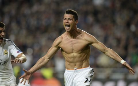 Real Madrid's Portuguese forward Cristiano Ronaldo celebrates after scoring during the UEFA Champions League Final Real Madrid vs Atletico de Madrid at Luz stadium in Lisbon, on May 24, 2014.   AFP PHOTO/ FRANCK FIFE