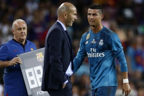 Real Madrid's Cristiano Ronaldo, right, reacts after referee Ricardo de Burgos showed a red card during the Spanish Supercup, first leg, soccer match between FC Barcelona and Real Madrid at Camp Nou stadium in Barcelona, Spain, Sunday, Aug. 13, 2017. (AP Photo/Manu Fernandez)