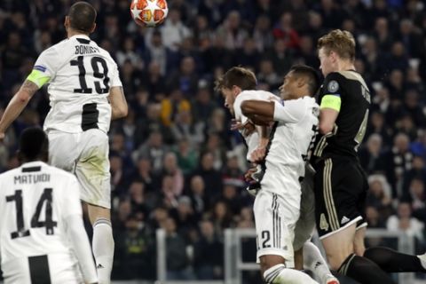 Ajax's Matthijs de Ligt, right, scores his side's second goal during the Champions League, quarterfinal, second leg soccer match between Juventus and Ajax, at the Allianz stadium in Turin, Italy, Tuesday, April 16, 2019. (AP Photo/Luca Bruno)