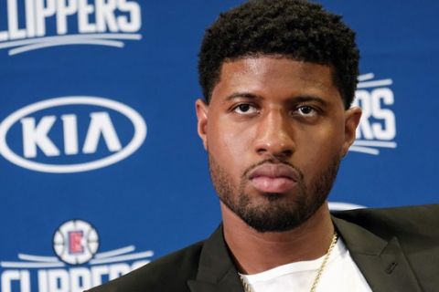 Paul George attends a press conference in Los Angeles, Wednesday, July 24, 2019. Nearly three weeks after the native Southern California superstars shook up the NBA by teaming up with the Los Angeles Clippers, the dynamic duo makes its first public appearance. (AP Photo/Ringo H.W. Chiu)