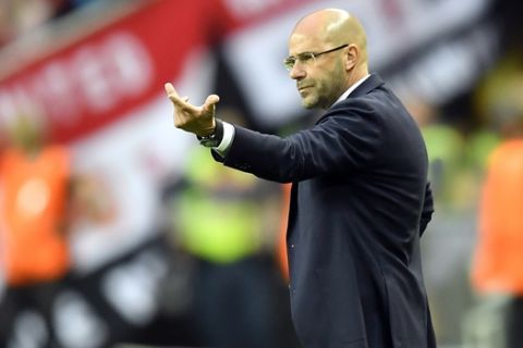 Ajax coach Peter Bosz gestures during the soccer Europa League final between Ajax Amsterdam and Manchester United at the Friends Arena in Stockholm, Sweden, Wednesday, May 24, 2017. (AP Photo/Martin Meissner)