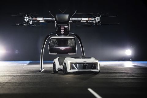 At Drone Week in Amsterdam Audi, Airbus and Italdesign are presenting for the first time a flying and driving prototype of Pop.Up Next. This innovative concept for a flying taxi combines a self-driving electric car with a passenger drone. In the first public test flight, the flight module accurately placed a passenger capsule on the ground module, which then drove from the test grounds autonomously. This is still a 1:4 scale model.