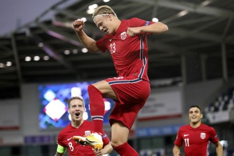 Norway's Erling Braut Haaland, center, celebrates his goal against Northern Ireland during the UEFA Nations League soccer match between Northern Ireland and Norway at Windsor Park, Belfast, Northern Ireland, Monday Sept. 7, 2020. (AP Photo/Peter Morrison)