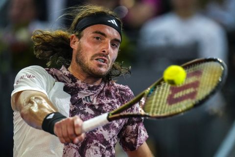Stefanos Tsitsipas of Greece returns the ball against Dominic Thiem of Austria during their match at the Madrid Open tennis tournament in Madrid, Spain, Saturday, April 29, 2023. (AP Photo/Manu Fernandez)