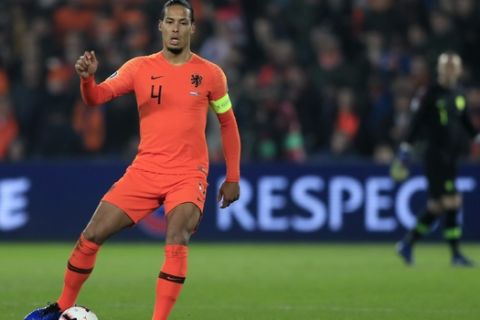 Netherlands' Virgil Van Dijk controls the ball during their Euro 2020 group C qualifying soccer match between Netherlands and Belarus at the Feyenoord stadium in Rotterdam, Netherlands, Thursday, March 21, 2019. (AP Photo/Peter Dejong)