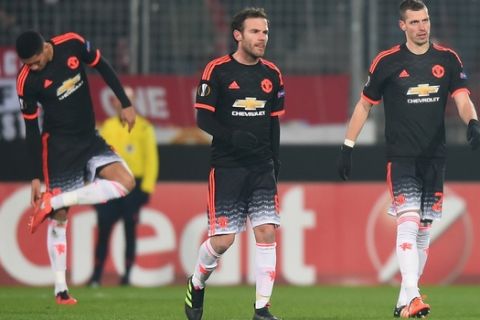 HERNING, DENMARK - FEBRUARY 18:  (L to R) Chris Smalling, Juan Mata and Morgan Schneiderlin of Manchester United react after Midtjylland's second goal during the UEFA Europa League round of 32 first leg match between FC Midtjylland and Manchester United at Herning MCH Multi Arena on February 18, 2016 in Herning, Denmark.  (Photo by Michael Regan/Getty Images)