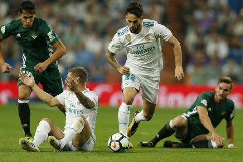 Real Madrid's Francisco Roman "Isco", second right, runs with the ball during Spanish the La Liga soccer match between Real Madrid and Real Betis at the Santiago Bernabeu stadium in Madrid, Wednesday, Sept. 20, 2017. Betis won 1-0. (AP Photo/Francisco Seco)