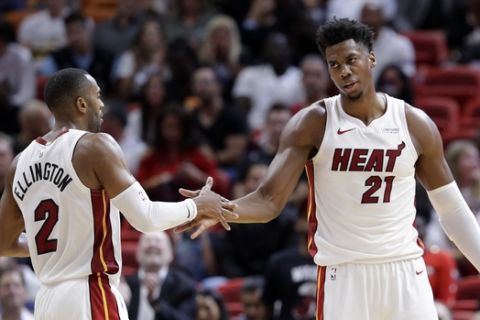 Miami Heat guard Wayne Ellington (2) shakes hands with center Hassan Whiteside (21) during the second half of an NBA basketball game against the San Antonio Spurs, Wednesday, Nov. 7, 2018, in Miami. The Heat won 95-88. (AP Photo/Lynne Sladky)